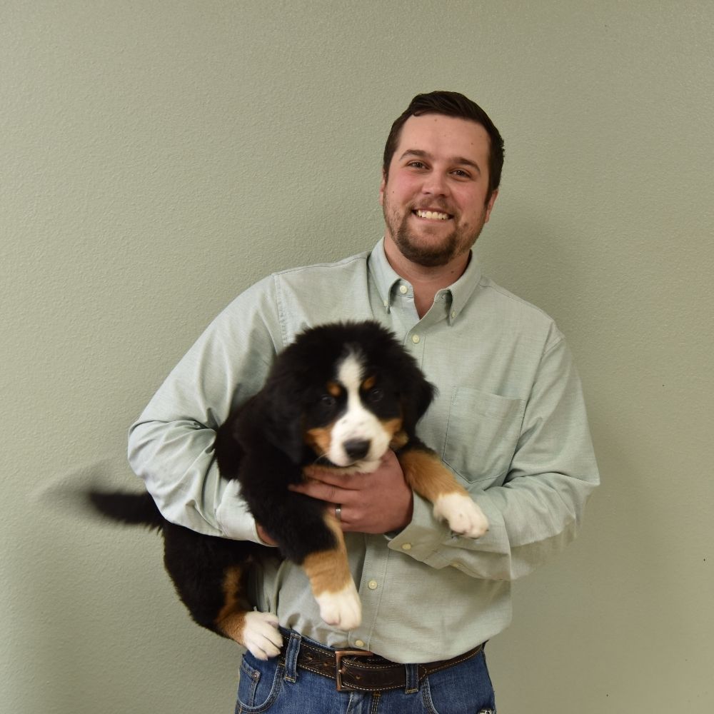 Man holding fluffy puppy